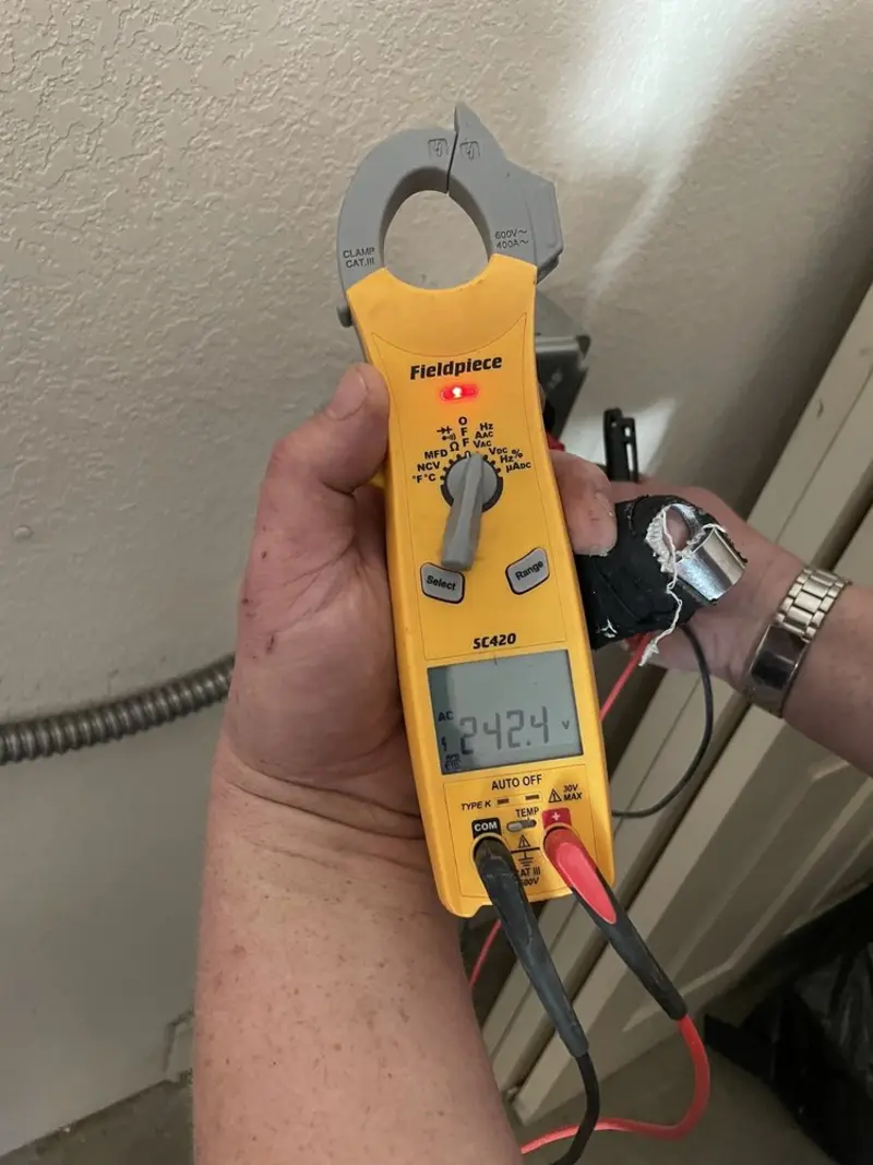 Voltage testing with clamp meter during Generator Installation in Haines City